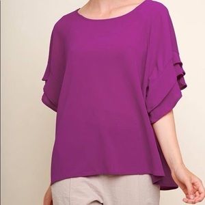 Magenta top with ruffle sleeves